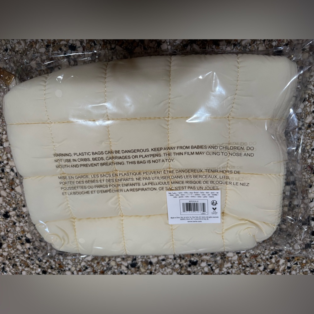 Cream/light yellow Tarte markup bag